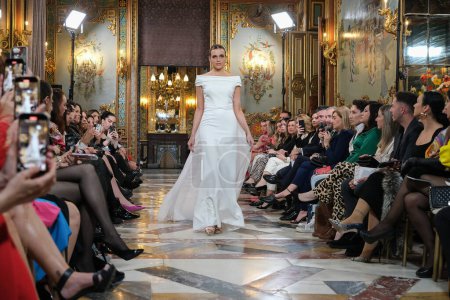 Photo for Model showcases creations by Silvia Fernandez during the Atelier Couture bridal catwalk within Madrid Fashion Week, at Santa Isabel Palace in Madrid. 13 marzo, 2024 Spain - Royalty Free Image