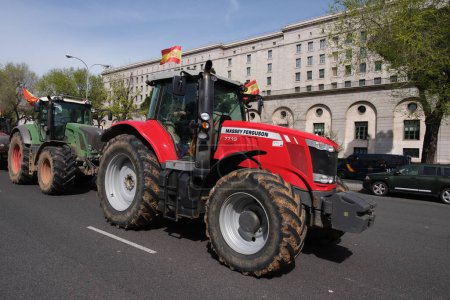 Photo for Several tractors during a protest by farmers and ranchers to demand improvements in the countryside sector in the center of Madrid, on March 17, 2024. - Royalty Free Image