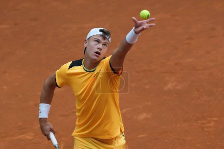Photo for Holger Rune of Norway  against Mariano Navone  during their second round match on day four of the Mutua Madrid Open at La Caja Magica on April 26, 2024 in Madrid, Spain - Royalty Free Image