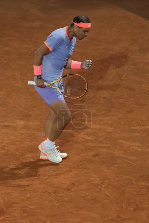 Photo for Rafael Nadal of Spain  against Alex de Minaur in the Men's Singles Round of 64 match during Day Five of the Mutua Madrid Open at La Caja Magica on April 27, 2024 in Madrid, Spain. - Royalty Free Image