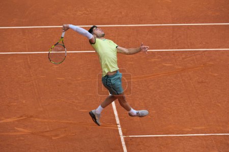 Photo for Carlos Alcaraz of Spain  against Thiago Seyboth  in the Men's Singles Round of 32 Match during Day Six of the Mutua Madrid Open at La Caja Magica on April 28, 2024 in Madrid, Spain. - Royalty Free Image