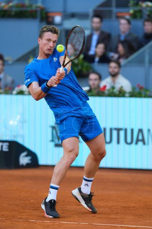 Photo for Jiri Lehecka of Czechia against Daniil Medvedev during the Men's Singles quarter-final match on Day Ten of Mutua Madrid Open at La Caja Magica on May 02, 2024 in Madrid, Spain. - Royalty Free Image