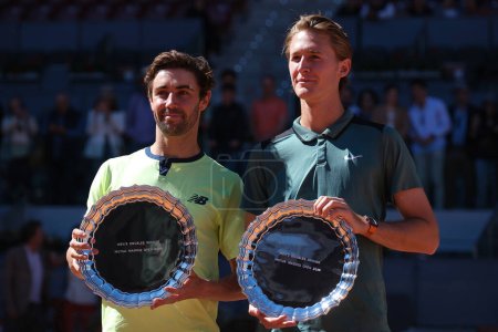 Photo for Jordan Thompson and Sebastian Korda  pose for with their Mutua Madrid Open Men's Doubles trophies following victory  during the  Doubles Final match at La Caja Magica on May 04, 2024 in Madrid, Spain - Royalty Free Image