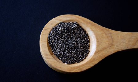 Healthy grains.Close-up photo.with dark background. Copy space.Chia grains, source of vitamins and omega-3.