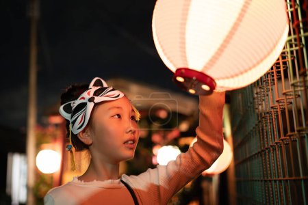 Photo for A girl enjoying a Japanese festival - Royalty Free Image