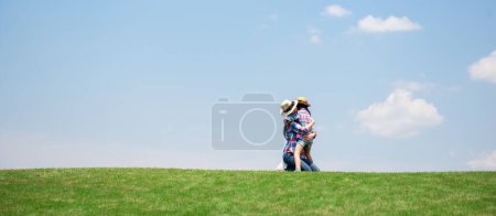 Photo for Mother and daughter playing in the meadow - Royalty Free Image