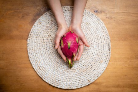 Photo for Female hands with dragon fruit - Royalty Free Image