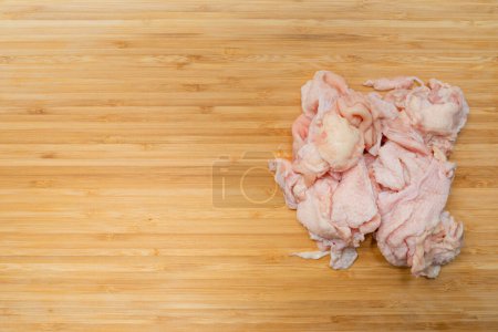 Photo for Raw chicken skin on table - Royalty Free Image