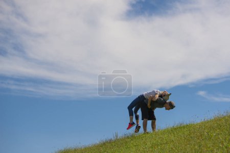 Photo for A couple exercising on lawn - Royalty Free Image