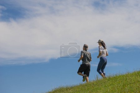 Photo for Couple jogging in the park - Royalty Free Image
