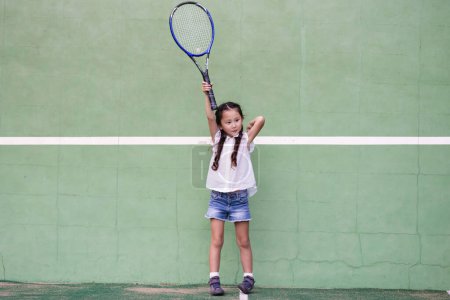 Photo for Girl playing on tennis court - Royalty Free Image