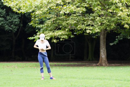 Japanese woman exercising in the park  