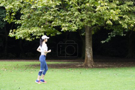 Japanese woman exercising in the park