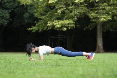 Photo for Japanese woman exercising in the park - Royalty Free Image