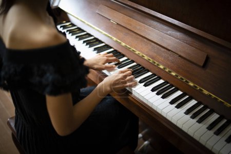 Photo for Woman to play the piano - Royalty Free Image