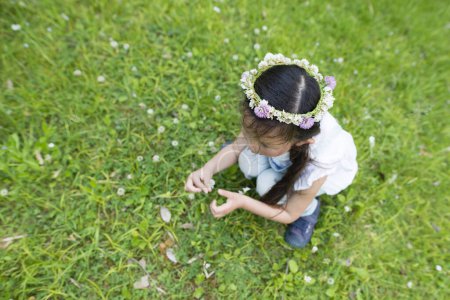 Photo for Girl wearing a flower tiara - Royalty Free Image