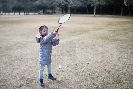 Photo for Little girl playing badminton - Royalty Free Image
