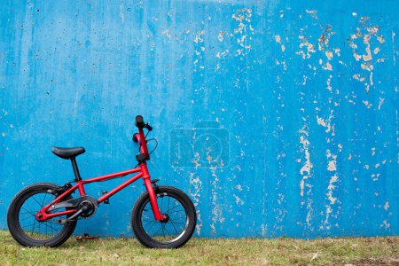 Photo for A red  bike on  wall background - Royalty Free Image