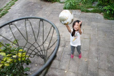 Photo for Asian girl playing basketball in the park - Royalty Free Image