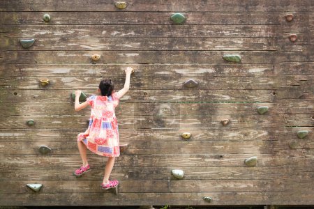Photo for Asian Girl training in  bouldering - Royalty Free Image