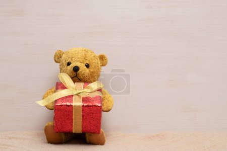Photo for Teddy bear with gift box - Royalty Free Image