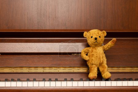 Photo for Piano and a teddy bear - Royalty Free Image