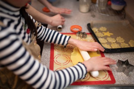 Photo for Hands of mother and daughter making cookies - Royalty Free Image