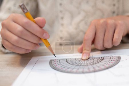 Photo for Child studying with a protractor - Royalty Free Image