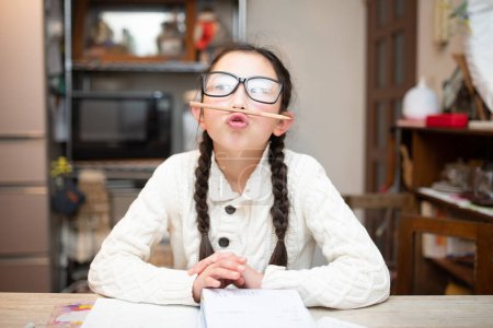 Photo for Girl with glasses tired of studying - Royalty Free Image