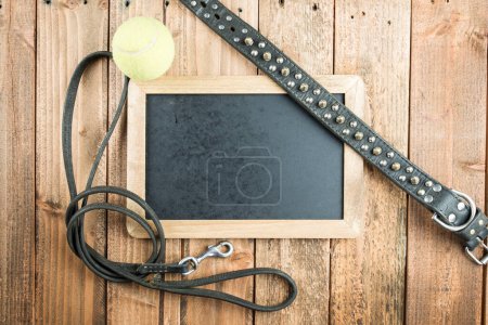 Photo for Collars and leads and tennis balls and blackboard - Royalty Free Image