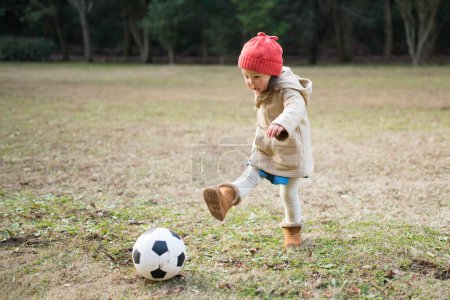 Photo for Girl playing with soccer ball - Royalty Free Image