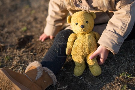 Photo for Child playing in the teddy bear - Royalty Free Image