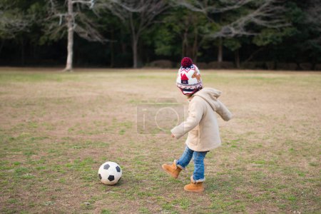 Photo for Girl playing with soccer ball - Royalty Free Image