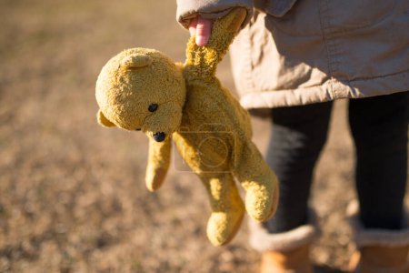Photo for Child playing in the teddy bear - Royalty Free Image