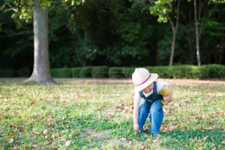 Photo for Girl playing on the lawn - Royalty Free Image