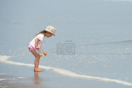 Photo for Girl playing on sea beach - Royalty Free Image