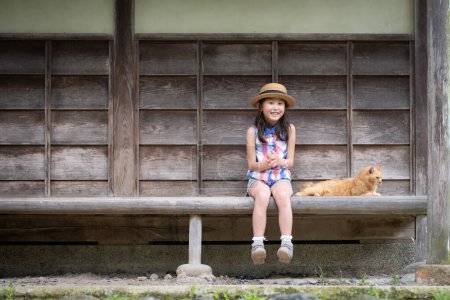 Photo for Cat and girl spending time on the porch - Royalty Free Image