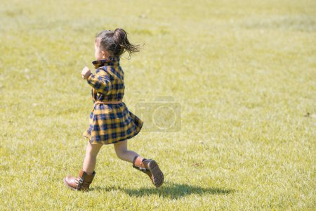 Photo for Girl playing in the field - Royalty Free Image