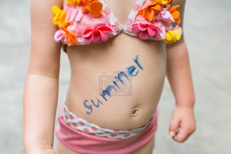 Photo for Girl wrote a summer in stomach - Royalty Free Image