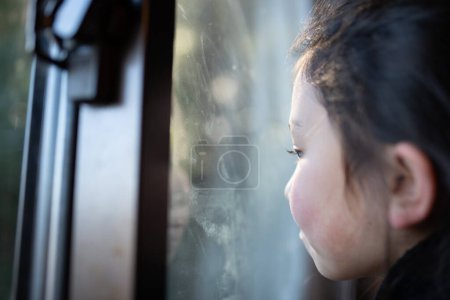 Photo for Girl looking out the window - Royalty Free Image