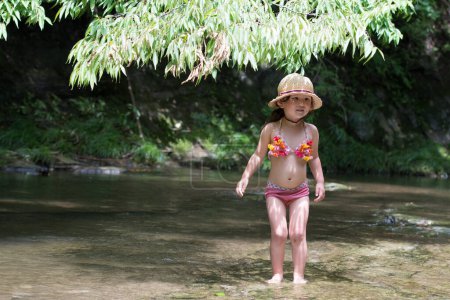 Photo for Girl playing in the river - Royalty Free Image