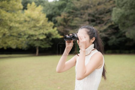 Photo for Woman to see with binoculars - Royalty Free Image