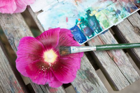 Photo for Hollyhock and paintbrush and palette - Royalty Free Image