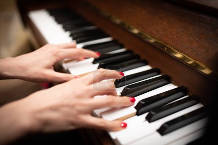 Photo for Female hands playing the piano - Royalty Free Image
