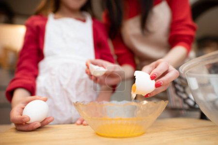 Photo for Mother and daughter making sweets - Royalty Free Image