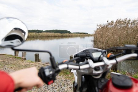 Photo for Sky and clouds reflected in a motorcycle mirror - Royalty Free Image