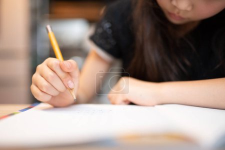 Photo for Hands of a girl studying - Royalty Free Image