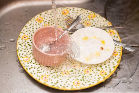 Photo for Tableware placed in the sink after meals - Royalty Free Image