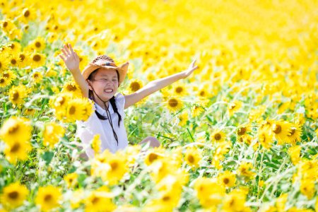 Photo for Girl playing in the sunflower field - Royalty Free Image