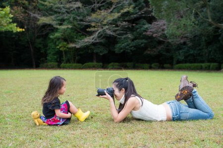 Photo for Mother and daughter play to take a photo - Royalty Free Image